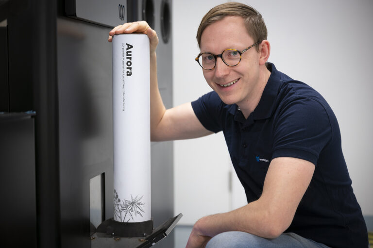 Robert-Kniola-refilling-powder-to-Gravity-3D-printer